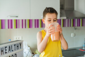 Kid drinking a smoothie