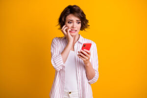 Woman with high cortisol and a phone